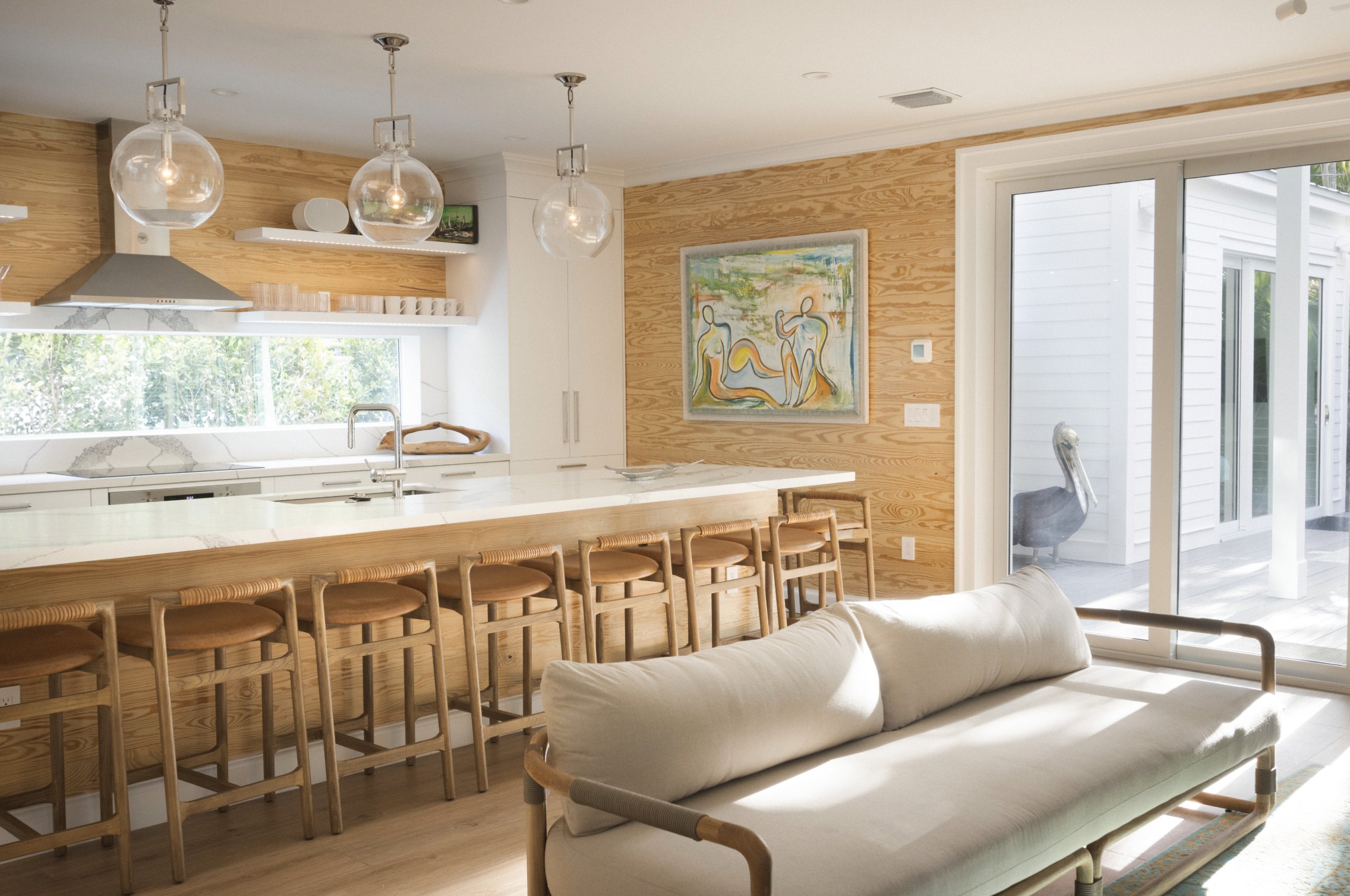Sunlit living room and kitchen at Rigby House